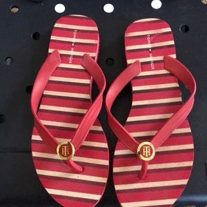 Red stripped flip flops